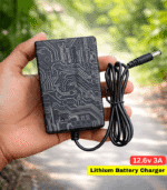 RC Product BD 12.6V 3A Lithium Battery Charger Short Description 12.6V 3A high-efficiency lithium battery charger for 12V (3S) battery packs. Fast 33W output with auto cut-off, LED indicator, and advanced safety protection. Ideal for lithium batteries and mini UPS charging. 📦 Product Description RC Product BD 12.6V 3A Lithium Battery Charger is a high-quality charger designed for 12V (3S) lithium-ion battery packs. It provides a stable 12.6V output with 3A current (≈33W) for fast and efficient charging. This charger uses advanced CC/CV charging technology to ensure safe and controlled charging, helping to extend battery lifespan. It features a full automatic cut-off system, where the LED indicator shows red during charging and turns green when fully charged, preventing overcharging. It is also suitable for charging mini UPS devices, making it a versatile solution for backup power systems. Built-in safety protections including overcurrent, overload, and short circuit protection ensure reliable and secure daily use. ________________________________________ 🔑 Key Features • Output: 12.6V 3A (≈33W Fast Charging) • Suitable for 12V (3S) Lithium-Ion Batteries • Smart CC/CV Charging System • Auto Cut-Off Function • LED Indicator (Red = Charging, Green = Full) • Compatible with Mini UPS • Multiple Safety Protection • Wide Input Voltage: 100V–240V AC